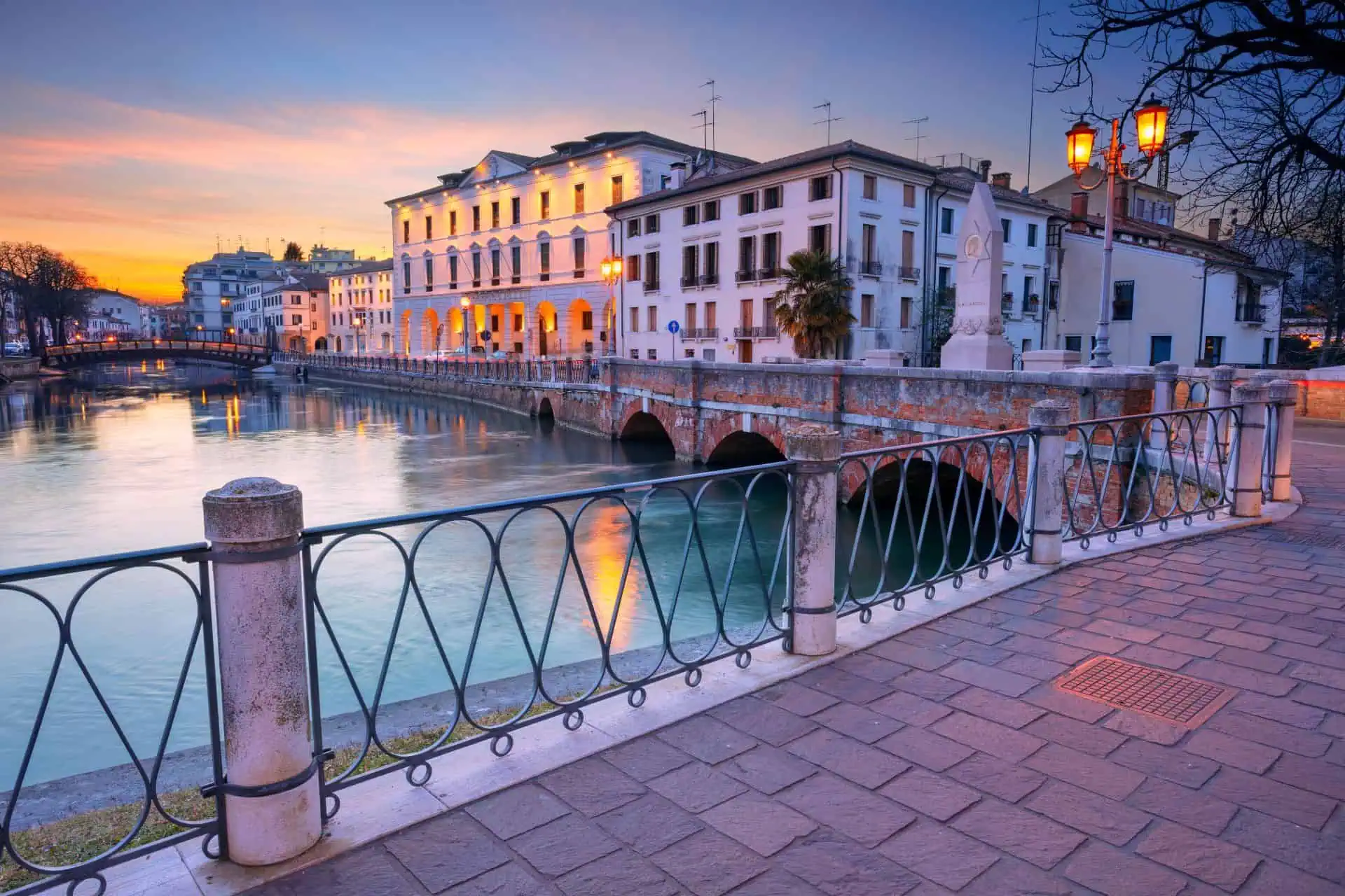 Treviso, Italy canals with historic buildings and cobblestone streets