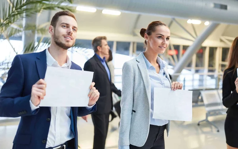 Business people with blank name tags for the guest